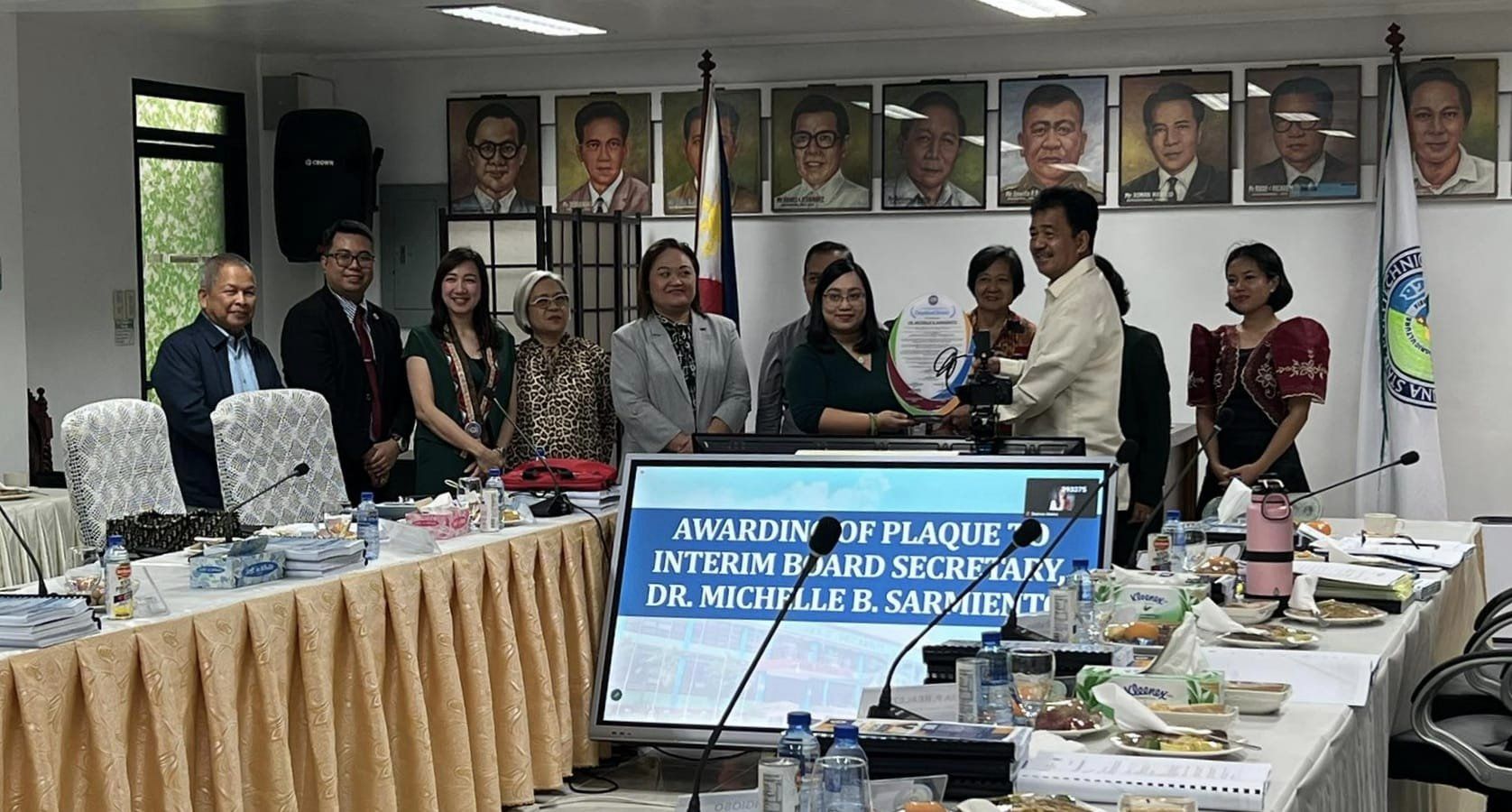 Dr. Sarmiento receives plaque of recognition for exceptional service
